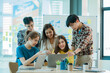 © ArLawKa - A group of young Asian businessmen stands to talk, discuss, and discuss working with the presentation of a new start-up project idea. Analysis of marketing and investment plans at the meeting