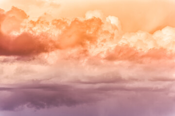 Wall Mural - twilight sky with effect of light pastel orange colors. colorful sunset of soft clouds.