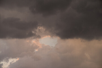 Wall Mural - twilight sky with effect of light pastel orange colors. colorful sunset of soft clouds.