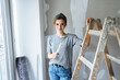 © contrastwerkstatt - Young woman renovating her bedroom