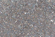 Gray Small Rocks Ground Texture. Black Small Road Stone Background. Gravel Pebbles Stone Seamless Texture. Dark Background Of Crushed Granite Gravel, Close Up. Clumping Clay.