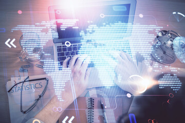 Aufkleber - Multi exposure of man's hands typing over computer keyboard and world map hologram drawing. Top view. Technology concept.