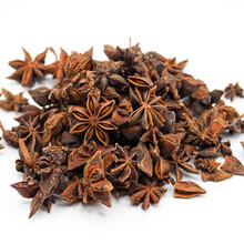 Heap Of Dried Star Anise Isolated On White Background. Spot Focus.