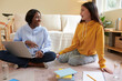 © DragonImages - Happy girl telling friend that she received confirmation email from university or college