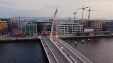 Samuel Beckett Bridge Over River Liffey In Dublin - Aerial View By Drone