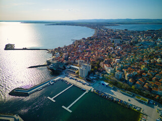 View from a height above the town of Pomorie with houses and streets washed by the Black Sea in Bulgaria