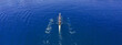 © aerial-drone - Aerial drone top ultra wide panoramic view of sport canoe rowing synchronous team of athletes competing in deep blue sea