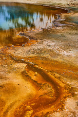 Detail of colorful waves in basin of Yellowstone by pools