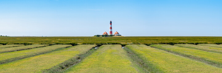 Wall Mural - westerheversand lighthouse along the salzwiesen (salt marsh), westerhever, nordfriesland, schleswig-