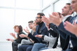 © ASDF - group of employees applauds during a business meeting