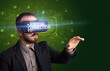© ra2 studio - Businessman looking through Virtual Reality glasses, social media concept