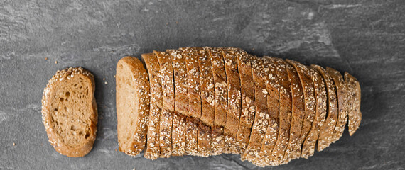 Wall Mural - Sliced whole grain bread with oat flakes. Wholemeal bread.