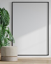 Vertical  Large One 1 Black Frame For A Photo Or Painting Art.Mockup Canvas Board Background. White Plaster Wall, Beige Velor Pouf And Large Monstera Palm.scandinavian Minimalist Style. 3d Rendering. 