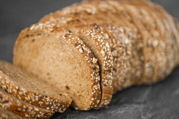 Wall Mural - Close-up image of a bread cutting on a white background isolated dark background