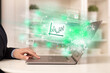 © ra2 studio - Young man watching stock market on laptop