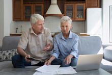 Worried Older Age Family Couple Pensioners Check Bills Using Pc Calculator Feel Nervous Discuss Debt Bankruptcy. Stressed Grandparents Find Lack Of Money On Pension Account Scared Of Financial Problem