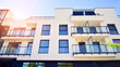 © Grand Warszawski - Modern apartment building. An innovative approach to residential architecture. Sunlight flare in the sky.