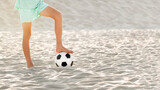 Fototapeta Sport - Beach soccer on sand. Bare feet of football player boy and ball on sandy sea shore. Sports games and activity of children on summer holidays