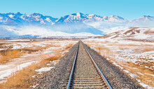 A Railroad To The Snowy Mountain Range