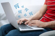 © New Africa - Man using laptop for online shopping at home, closeup