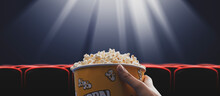 Woman Eating Popcorn At The Cinema