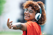 Leinwandbild Motiv african american girl with headphones dancing happy