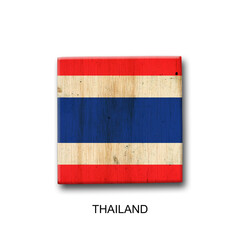 Wall Mural - Thailand flag on a wooden block. Isolated on white background. Signs and symbols.
