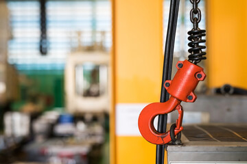 Red Crane hook of overhead crane in manufacturing factory