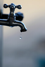 Ilheus, Bahia, Brazil - May 22, 2022: Water Drop Falling From A Leaking Faucet In The City Of Ilheus.