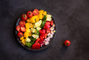 Wall Mural - Fresh vegetables salad with tomatoes, peppers, cucumbers and other ingredients, healthy eating