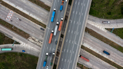 Wall Mural - Aerial top view road traffic interchange in city, Aerial view of highway and overpass in city, Expressway top view, Road traffic an important infrastructure.