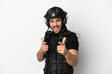 Wall Mural - Young caucasian swat isolated on white background pointing to the front and smiling