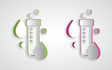 Paper cut Test tube with water drop icon isolated on grey background. Paper art style. Vector