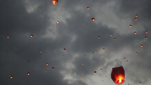 Many Sky Lanterns In The Sky. Floating Lanterns Ceremony Or Yeepeng Ceremony, Traditional Lanna Buddhist Ceremony In City
