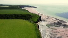 Aerial View Of MonkNash Coast Known As The Jurassic Coast In South Wales Uk. View Of Beach From A Drone Above During Summer Time