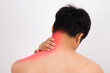 © Rurgrit - Asian man with pain from shoulder to neck is using his hands to massage the pain point. It is considered a health problem, myositis or office syndrome.