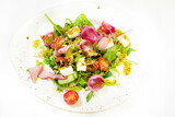 Fototapeta  - sałatka na talerzu , białe tło, zielone warzywa, zdrowe jedzenie