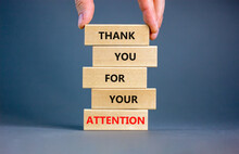 Thank You For Attention Symbol. Concept Words Thank You For Your Attention On Wooden Blocks On A Beautiful Grey Table Grey Background. Businessman Hand. Business And Thank You For Attention Concept.