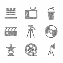 Wall Mural - Set Tripod, Film reel, Movie spotlight, CD or DVD disk, trophy, clapper, Paper glass with straw and Cinema auditorium seats icon. Vector