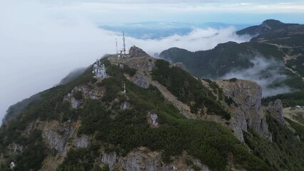 Wall Mural - fog and clouds in the mountain Ceahlau, Romania. aerial view