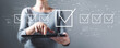 © Tierney - Checklist concept with business woman using a tablet computer