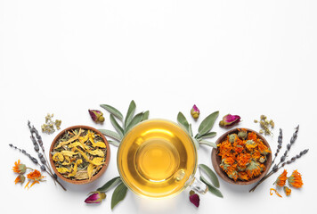 Freshly brewed tea and dried herbs on white background, top view. Space for text