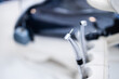 © padnob - Dental instrument in stomatology clinic. Close up compressed nozzle air. Professional dentist tools. Selective focus.