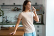 © Stock 4 You - Young woman drinking pure water from glass in kitchen