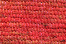 Shades Of Red Wool Yarn Cloth Abstract Background. Surface Of Fabric Texture In Red, Crimson, Reddish Yellow  And Orange Color.