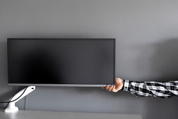 person push the button to turn on the monitor