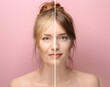 © Pixel-Shot - Beautiful young woman with silky skin on color background
