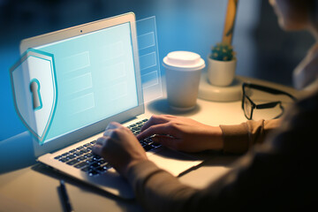 Woman using laptop with blocked screen at table. Concept of online safety
