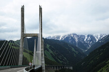 Fruit Valley Bridge With Remote Snow Mountains