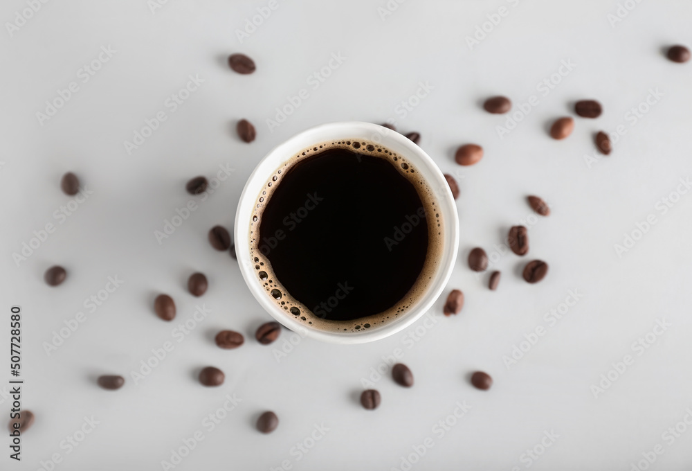 Takeaway paper cup of coffee and beans on light background